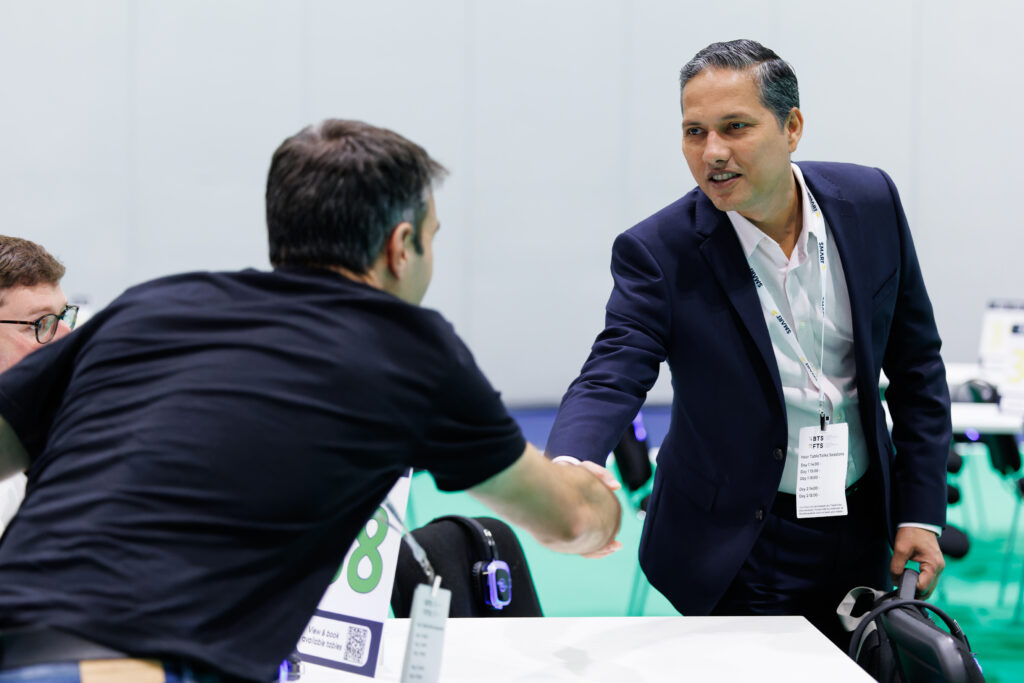 Banking Transformation Summit attendees shaking hands